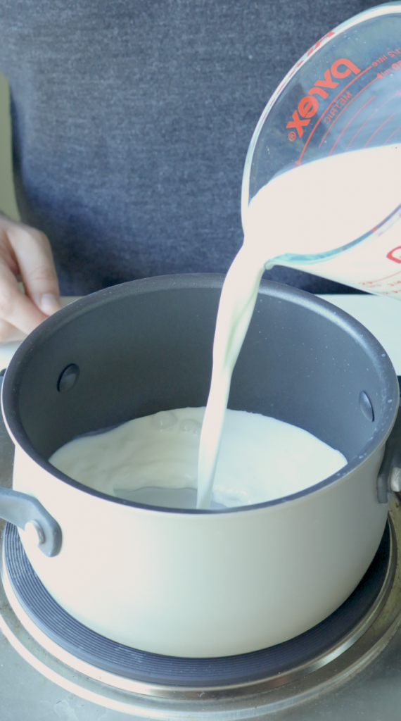 1. Start by measuring 2 cups whole milk. Pour one and half cups into a sauce pan.
2. Then the last half cup, mix with 1/3 cup corn starch.
3. Then add that into the sauce pan with the rest of the milk.